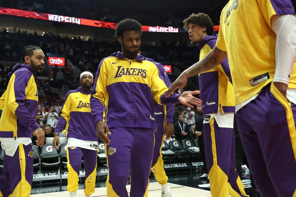 Apr 13, 2025; Portland, Oregon, USA; Los Angeles Lakers guard Bronny James (9) enters the line up before playing in a game against the Portland Trail Blazers at Moda Center. Mandatory Credit: Jaime Valdez-Imagn Images