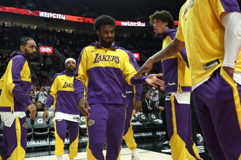 Apr 13, 2025; Portland, Oregon, USA; Los Angeles Lakers guard Bronny James (9) enters the line up before playing in a game against the Portland Trail Blazers at Moda Center. Mandatory Credit: Jaime Valdez-Imagn Images
