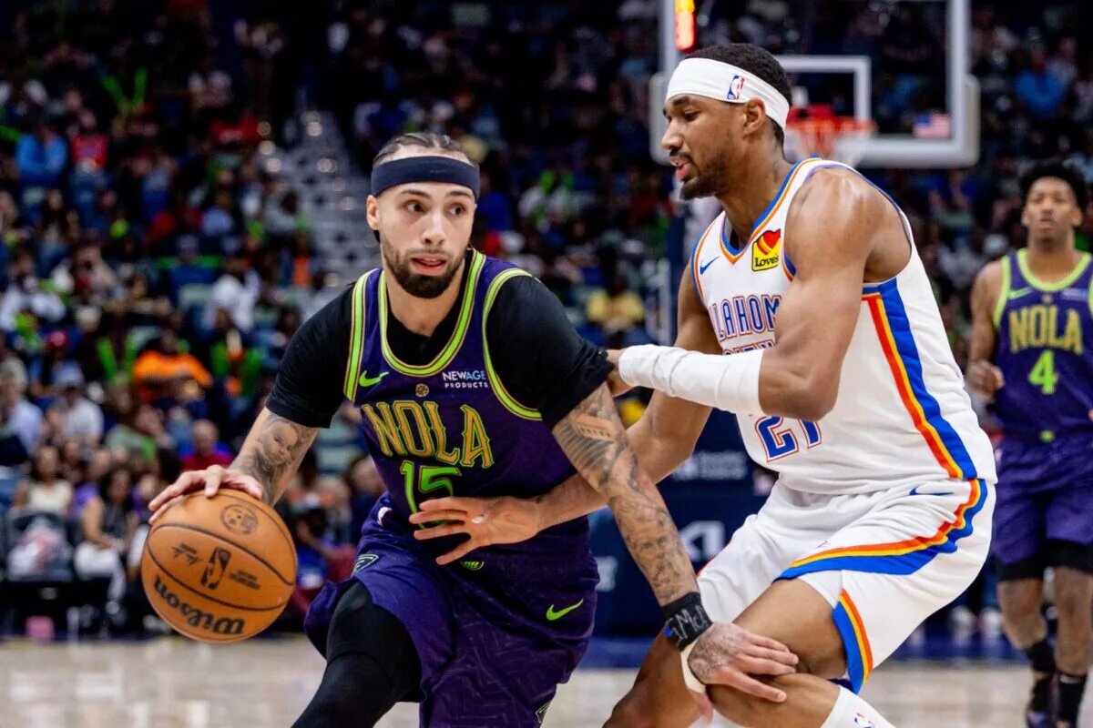 Apr 13, 2025; New Orleans, Louisiana, USA; New Orleans Pelicans guard Jose Alvarado (15) dribbles against Oklahoma City Thunder guard Aaron Wiggins (21) during the second half at Smoothie King Center. Mandatory Credit: Stephen Lew-Imagn Images