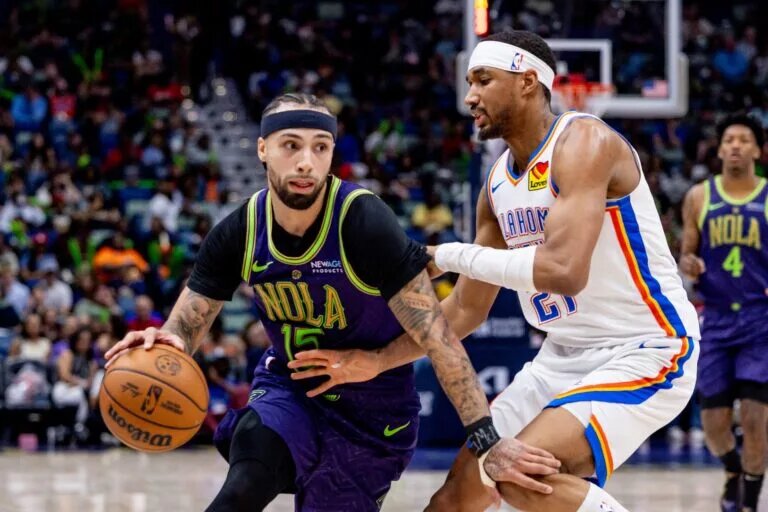 Apr 13, 2025; New Orleans, Louisiana, USA; New Orleans Pelicans guard Jose Alvarado (15) dribbles against Oklahoma City Thunder guard Aaron Wiggins (21) during the second half at Smoothie King Center. Mandatory Credit: Stephen Lew-Imagn Images