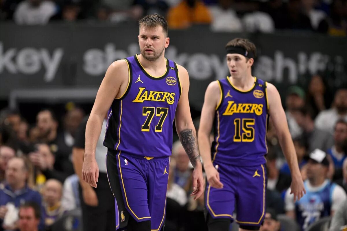 Apr 9, 2025; Dallas, Texas, USA; Los Angeles Lakers guard Luka Doncic (77) and guard Austin Reaves (15) during the game between the Dallas Mavericks and the Los Angeles Lakers at American Airlines Center. Mandatory Credit: Jerome Miron-Imagn Images