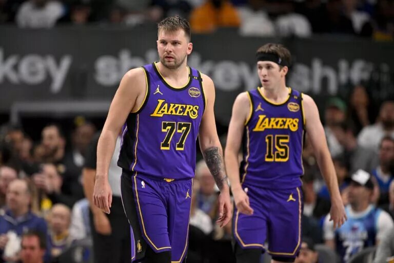 Apr 9, 2025; Dallas, Texas, USA; Los Angeles Lakers guard Luka Doncic (77) and guard Austin Reaves (15) during the game between the Dallas Mavericks and the Los Angeles Lakers at American Airlines Center. Mandatory Credit: Jerome Miron-Imagn Images