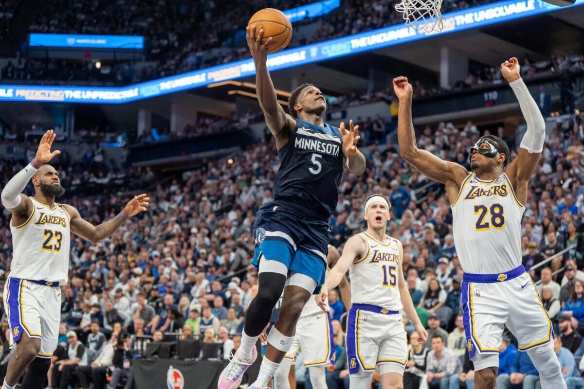 Apr 27, 2025; Minneapolis, Minnesota, USA; Minnesota Timberwolves guard Anthony Edwards (5) shoots with Los Angeles Lakers forward Rui Hachimura (28) on defense in the third quarter during game four of first round for the 2025 NBA Playoffs at Target Center. Mandatory Credit: Matt Blewett-Imagn Images