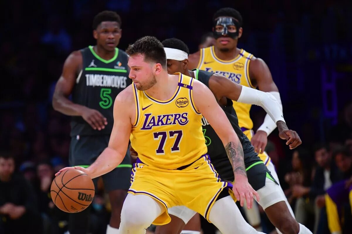 Apr 30, 2025; Los Angeles, California, USA; Los Angeles Lakers guard Luka Doncic (77) controls the ball against the Minnesota Timberwolves during the second half in game five of first round for the 2025 NBA Playoffs at Crypto.com Arena. Mandatory Credit: Gary A. Vasquez-Imagn Images