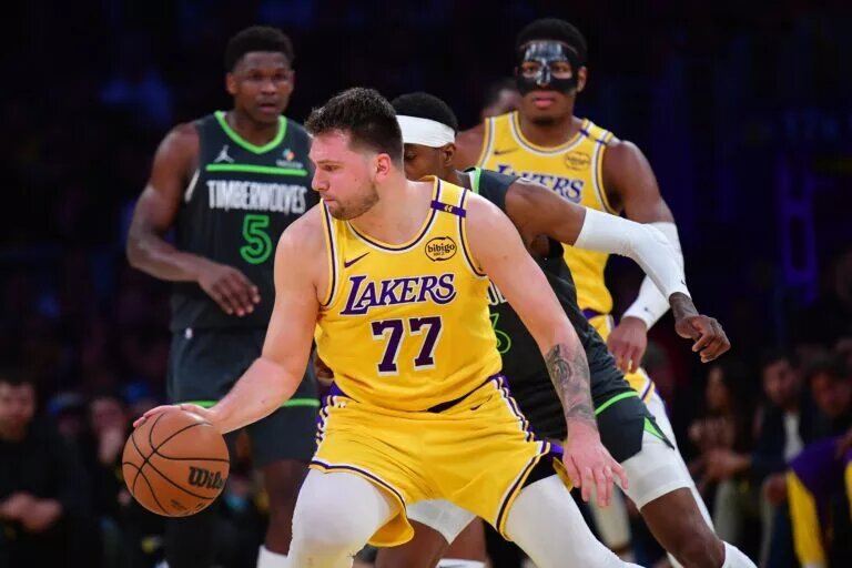Apr 30, 2025; Los Angeles, California, USA; Los Angeles Lakers guard Luka Doncic (77) controls the ball against the Minnesota Timberwolves during the second half in game five of first round for the 2025 NBA Playoffs at Crypto.com Arena. Mandatory Credit: Gary A. Vasquez-Imagn Images