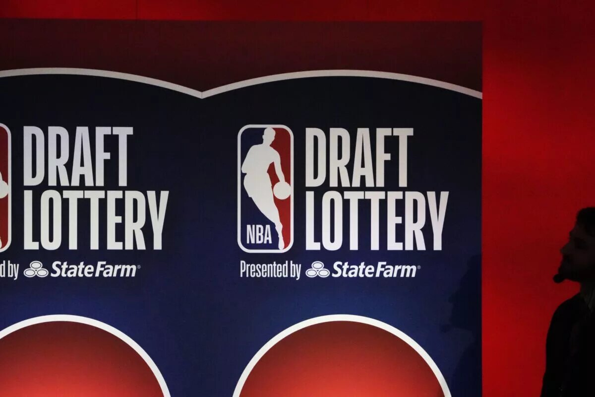 May 12, 2025; Chicago, Illinois, US; A person watches the 2025 NBA Draft Lottery at McCormick Place. Mandatory Credit: David Banks-Imagn Images
