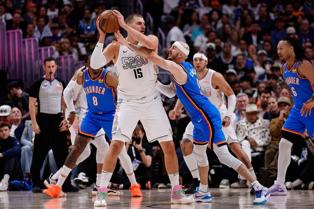 May 15, 2025; Denver, Colorado, USA; Denver Nuggets center Nikola Jokic (15) controls the ball under pressure form Oklahoma City Thunder guard Alex Caruso (9) in the second quarter during game six of the second round for the 2025 NBA Playoffs at Ball Arena. Mandatory Credit: Isaiah J. Downing-Imagn Images