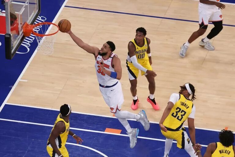 May 29, 2025; New York, New York, USA; New York Knicks center Karl-Anthony Towns (32) shoots against the Indiana Pacers in the fourth quarter during game five of the eastern conference finals for the 2025 NBA Playoffs at Madison Square Garden. Mandatory Credit: Brad Penner-Imagn Images