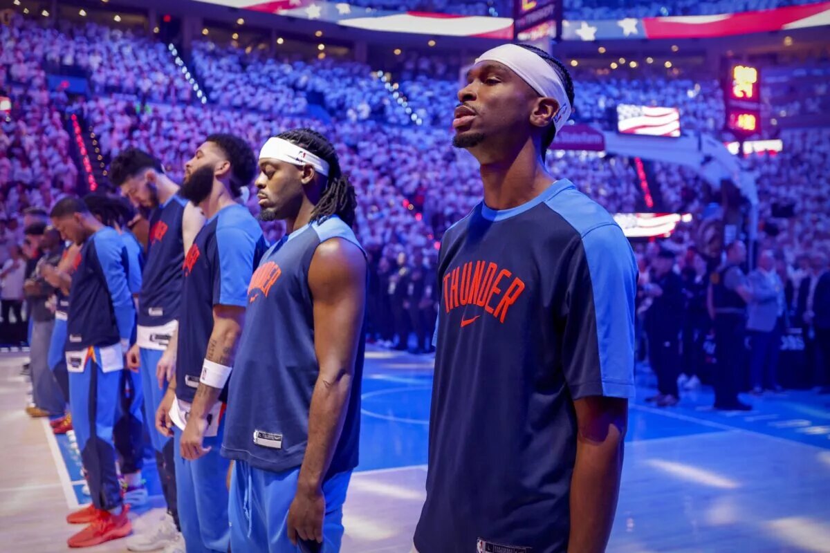 Jun 5, 2025; Oklahoma City, Oklahoma, USA; Oklahoma City Thunder guard Shai Gilgeous-Alexander (2) stands during the national anthem before the first quarter against the Indiana Pacers during game one of the 2025 NBA Finals at Paycom Center. Mandatory Credit: Alonzo Adams-Imagn Images