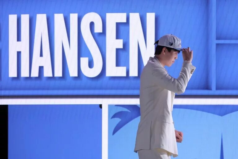 Jun 25, 2025; Brooklyn, NY, USA; Yang Hansen looks on after being selected as the 16th pick by the Memphis Grizzlies in the first round of the 2025 NBA Draft at Barclays Center. Mandatory Credit: Brad Penner-Imagn Images