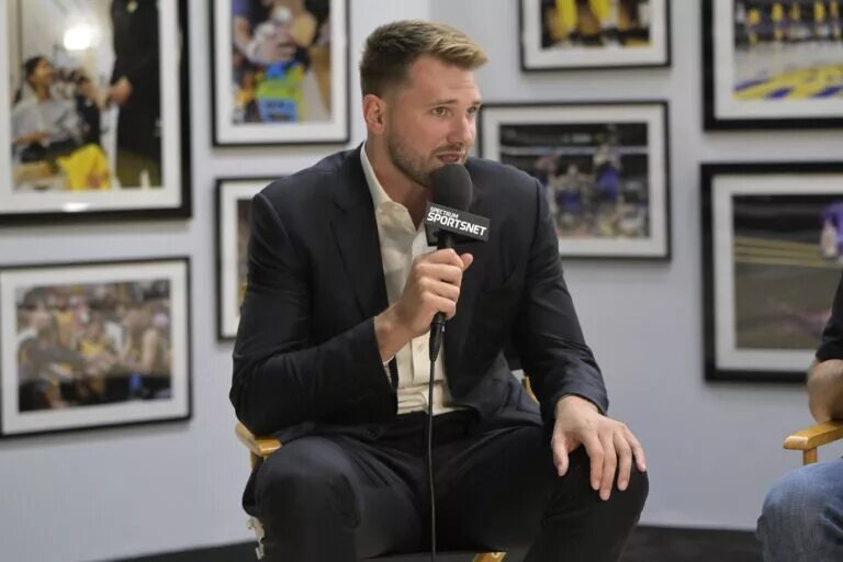 Aug 2, 2025; El Segundo, CA, USA; Los Angeles Lakers Luka Doncic (77) is interviewed Spectrum SportsNet following a press conference announcing the signing of his contract extension at UCLA Health Training Center. Mandatory Credit: Jayne Kamin-Oncea-Imagn Images