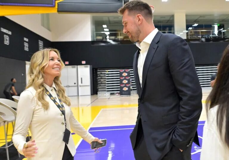 Aug 2, 2025; El Segundo, CA, USA; Los Angeles Lakers Luka Doncic (77) talks with team co-owner Jeanie Buss following a press conference announcing the signing of a 3-year, $165 million contract extension at UCLA Health Training Center. Mandatory Credit: Jayne Kamin-Oncea-Imagn Images