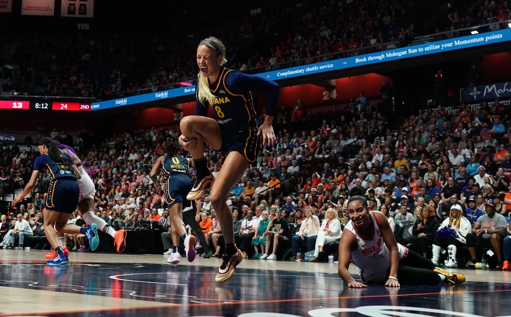 Aug 17, 2025; Uncasville, Connecticut, USA; Indiana Fever guard Sophie Cunningham (8) is injured on a play against Connecticut Sun guard Bria Hartley (14) in the first half at Mohegan Sun Arena. Mandatory Credit: David Butler II-Imagn Images