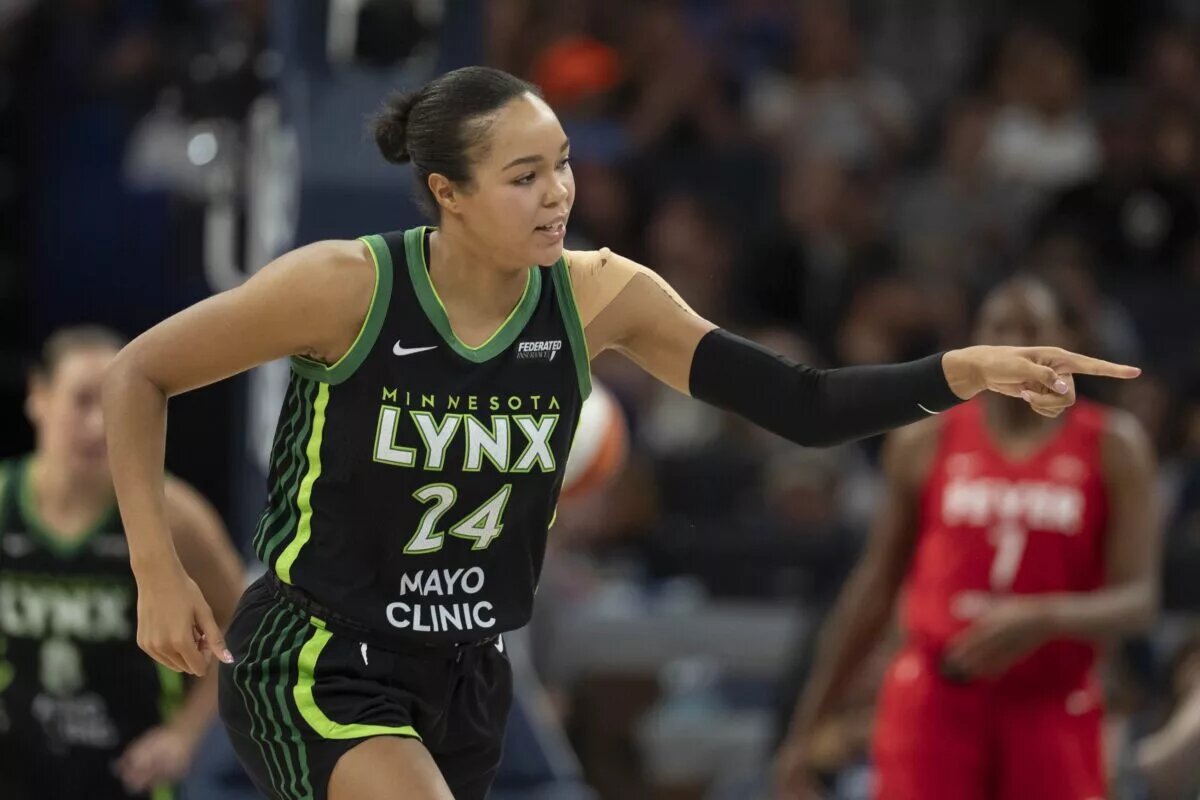 Aug 24, 2025; Minneapolis, Minnesota, USA; Minnesota Lynx forward Napheesa Collier (24) points to the bench after making a three point shot against the Indiana Fever in the second half at Target Center. Mandatory Credit: Jesse Johnson-Imagn Images