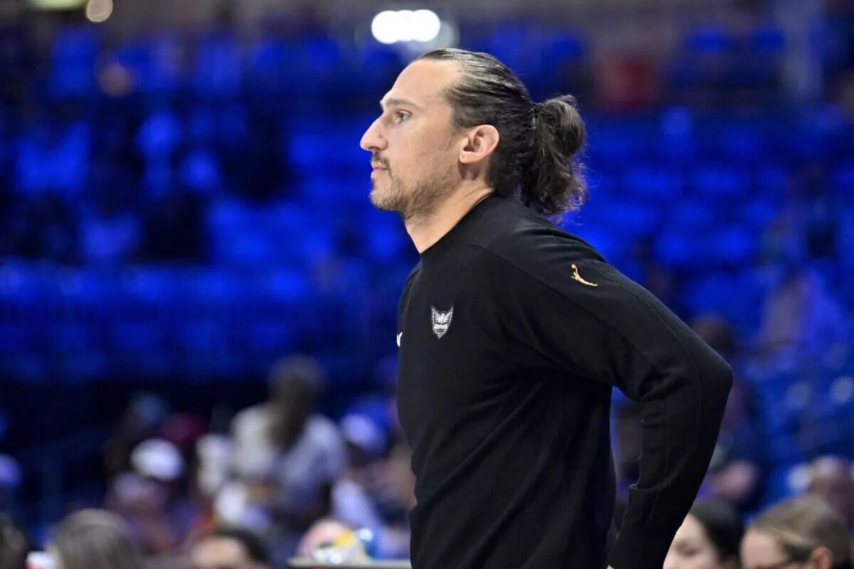 Aug 27, 2025; Arlington, Texas, USA; Dallas Wings head coach Chris Koclanes looks on during the first half against the Connecticut Sun at College Park Center. Mandatory Credit: Jerome Miron-Imagn Images