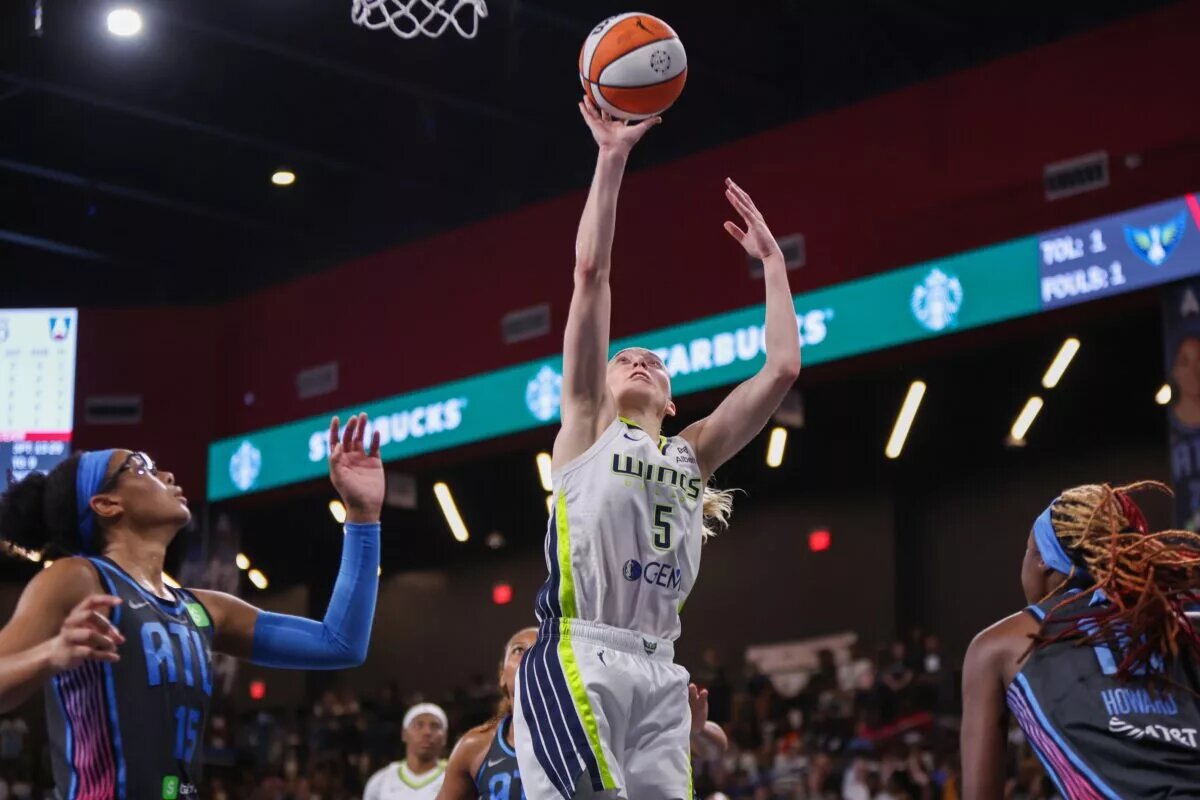Aug 29, 2025; College Park, Georgia, USA; Dallas Wings guard Paige Bueckers (5) shoots against the Atlanta Dream in the fourth quarter at Gateway Center Arena at College Park. Mandatory Credit: Brett Davis-Imagn Images