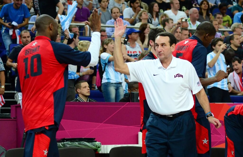 Coach K high-fives Kobe Bryant with Team USA