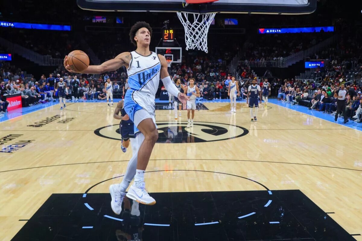 Nov 25, 2024; Atlanta, Georgia, USA; Atlanta Hawks forward Jalen Johnson (1) dunks against the Dallas Mavericks in the first half at State Farm Arena. Mandatory Credit: Brett Davis-Imagn Images
