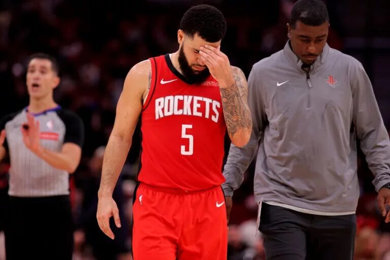 Houston Rockets guard Fred VanVleet (5) is escorted off the court after being ejected against the Miami Heat during the fourth quarter at Toyota Center.