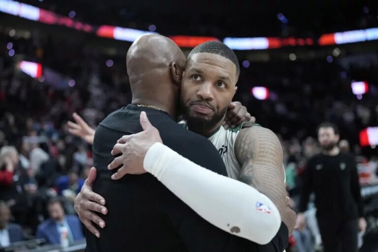 Jan 28, 2025; Portland, Oregon, USA; Portland Trail Blazers head coach Chauncey Billups embraces Milwaukee Bucks point guard Damian Lillard (0, right) after a game at Moda Center. Mandatory Credit: Soobum Im-Imagn Images