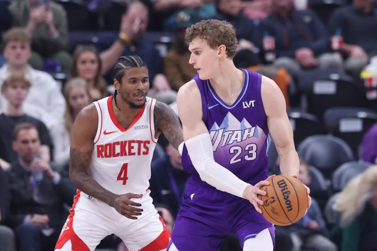 Feb 22, 2025; Salt Lake City, Utah, USA; Utah Jazz forward Lauri Markkanen (23) posts up against Houston Rockets guard Jalen Green (4) during the second half at Delta Center. Mandatory Credit: Rob Gray-Imagn Images