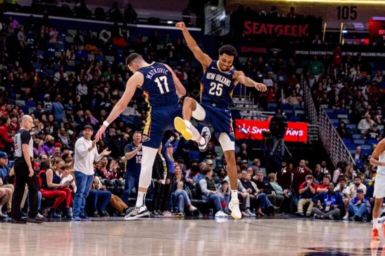 New Orleans Pelicans guard Trey Murphy III (25) celebrates making a three point basket with center Karlo Matkovic
