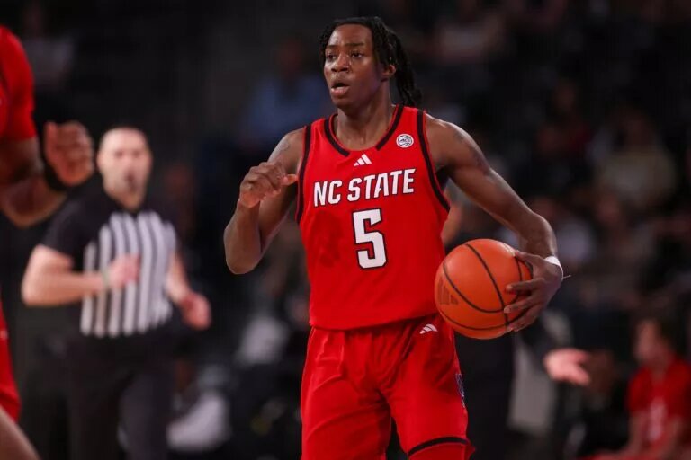 Mar 1, 2025; Atlanta, Georgia, USA; North Carolina State Wolfpack guard Trey Parker (5) handles the ball against the Georgia Tech Yellow Jackets in the first half at McCamish Pavilion. Mandatory Credit: Brett Davis-Imagn Images