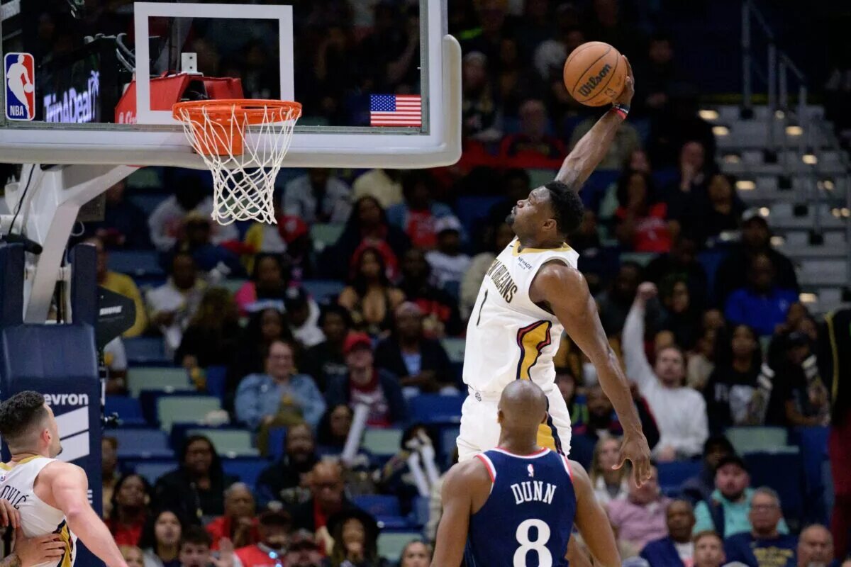 Mar 11, 2025; New Orleans, Louisiana, USA; New Orleans Pelicans forward Zion Williamson (1) dunks against Los Angeles Clippers guard Kris Dunn (8) during the second half at Smoothie King Center. Mandatory Credit: Matthew Hinton-Imagn Images