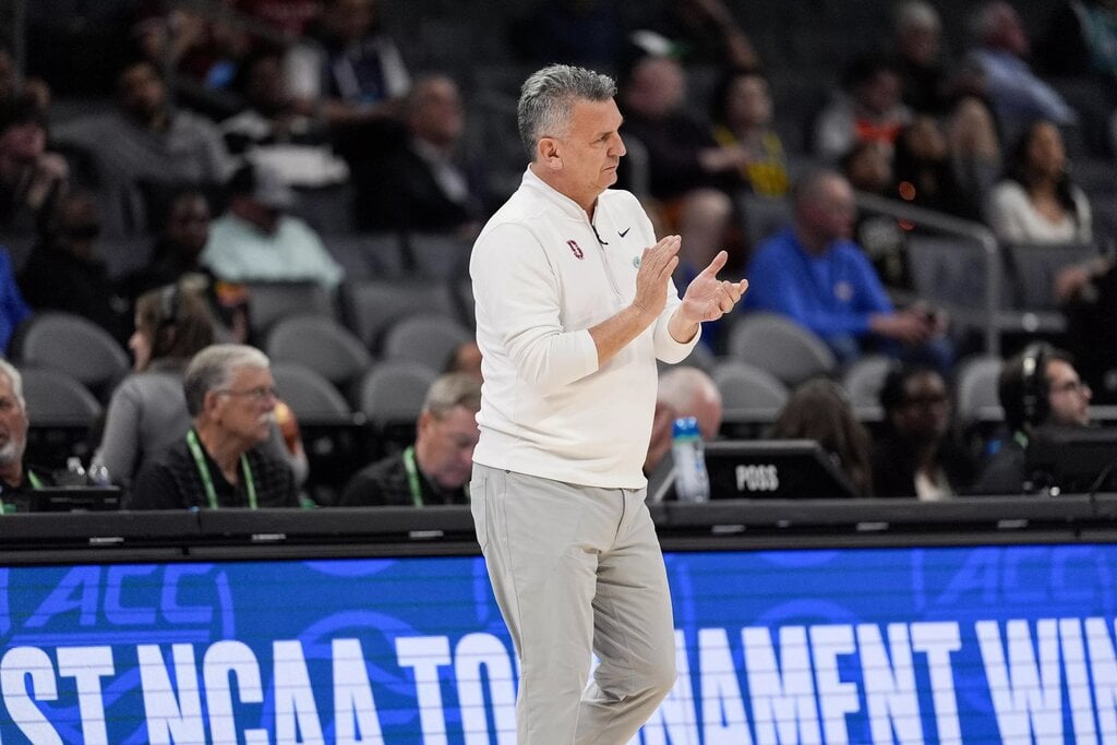 Mar 12, 2025; Charlotte, NC, USA; Stanford Cardinal head coach Kyle Smith applauds his team against the California Golden Bears during the first half at Spectrum Center. Mandatory Credit: Jim Dedmon-Imagn Images