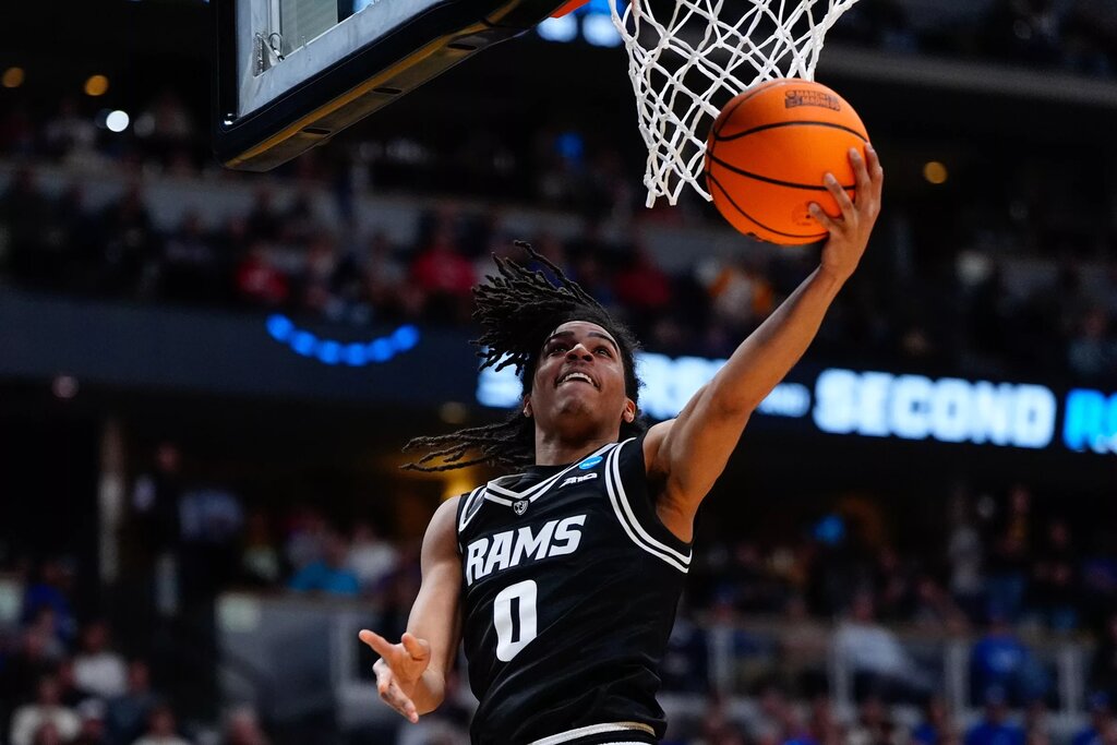 Mar 20, 2025; Denver, CO, USA; VCU Rams guard Brandon Jennings (0) shoots the ball against the Brigham Young Cougars during the second half in the first round of the NCAA Tournament at Ball Arena. Mandatory Credit: Ron Chenoy-Imagn Images