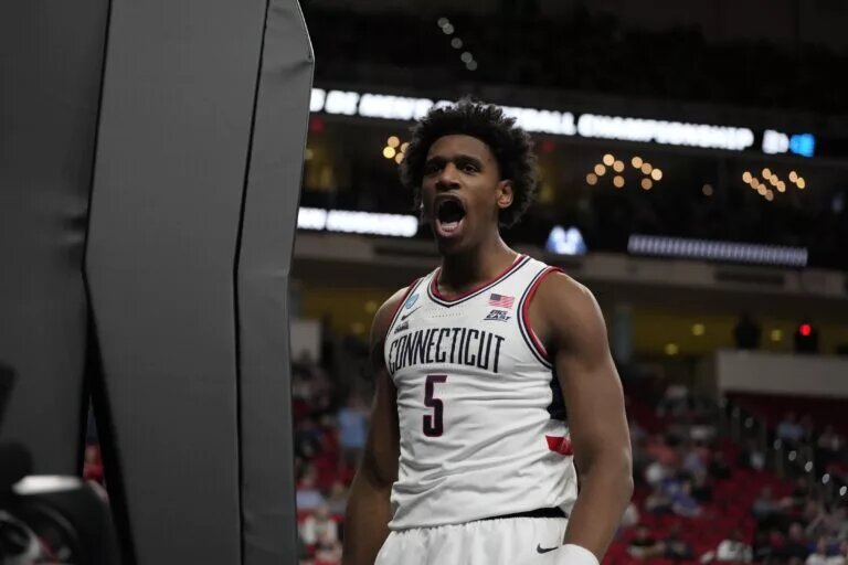 Mar 21, 2025; Raleigh, NC, USA; Connecticut Huskies center Tarris Reed Jr. (5) reacts during the second half against the Oklahoma Sooners at Lenovo Center. Mandatory Credit: Bob Donnan-Imagn Images