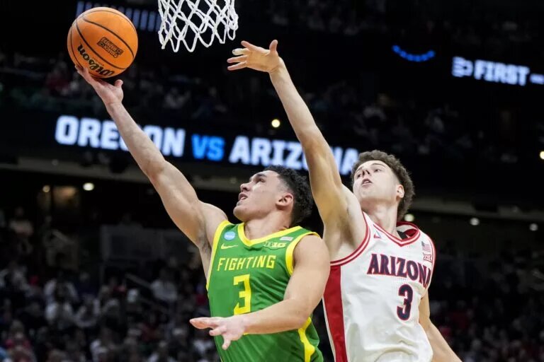 Mar 23, 2025; Seattle, WA, USA; Oregon Ducks guard Jackson Shelstad (3) drives to the basket against Arizona Wildcats guard Anthony Dell'Orso (3) in the second half at Climate Pledge Arena. Mandatory Credit: Stephen Brashear-Imagn Images