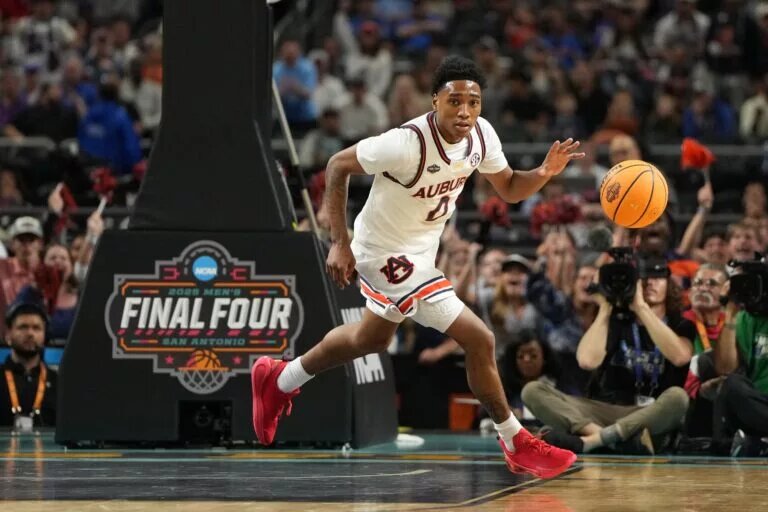 Apr 5, 2025; San Antonio, TX, USA; Auburn Tigers guard Tahaad Pettiford (0) drives to the basket against the Florida Gators during the first half in the semifinals of the men's Final Four of the 2025 NCAA Tournament at the Alamodome. Mandatory Credit: Bob Donnan-Imagn Images
