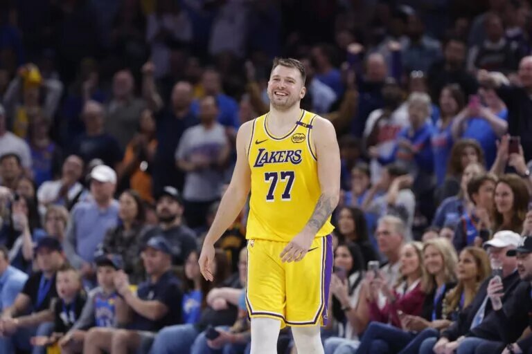 Apr 8, 2025; Oklahoma City, Oklahoma, USA; Los Angeles Lakers guard Luka Doncic (77) smiles after a technical is called against him during the second half of a game against the Oklahoma City Thunder at Paycom Center. Mandatory Credit: Alonzo Adams-Imagn Images