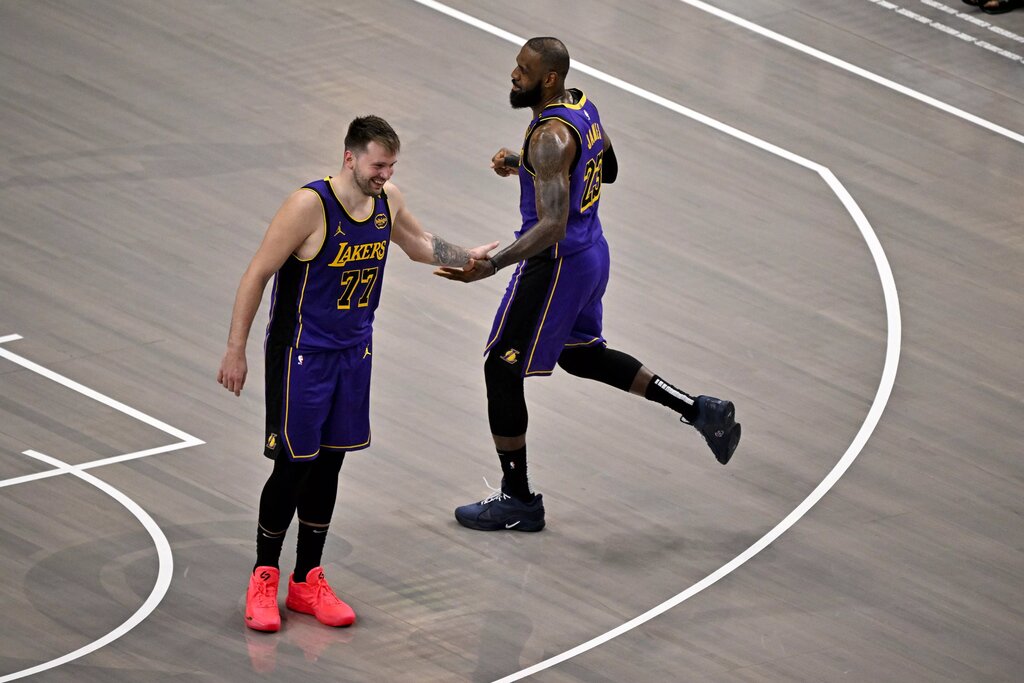 Los Angeles Lakers guard Luka Doncic (77) and Lakers forward LeBron James