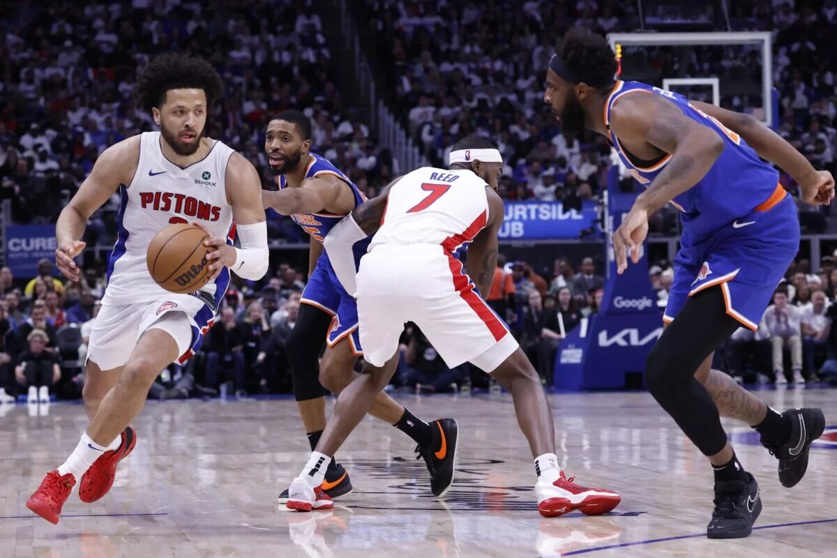 Detroit Pistons guard Cade Cunningham comes off Paul Reed's screen