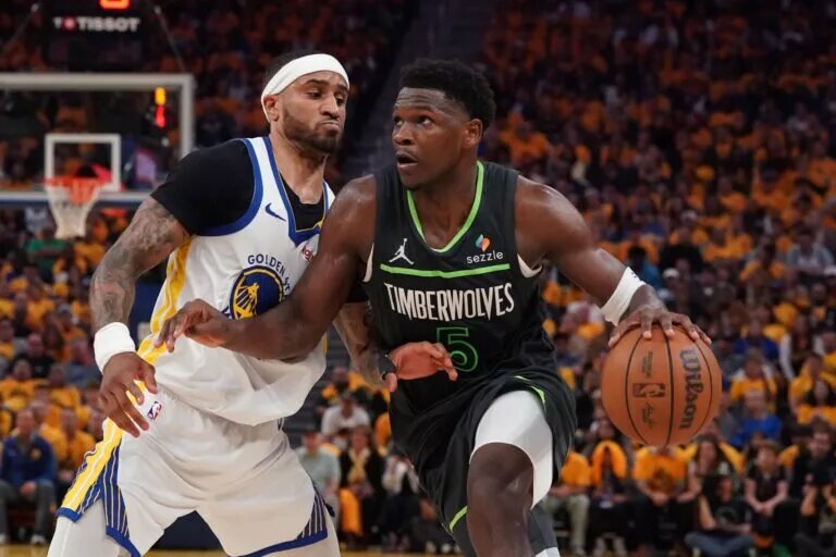 Golden State Warriors guard Gary Payton II defends Minnesota Timberwolves wing Anthony Edwards