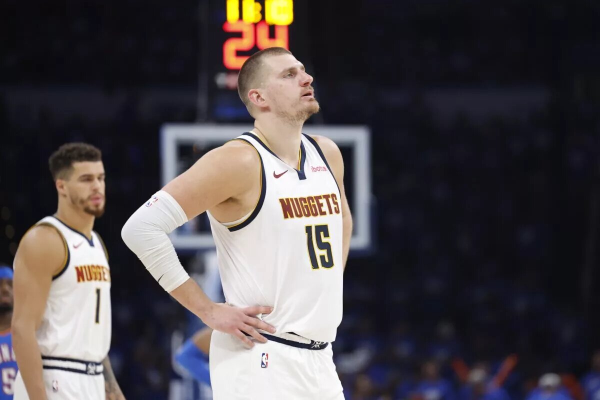 May 18, 2025; Oklahoma City, Oklahoma, USA; Denver Nuggets center Nikola Jokic (15) watches Oklahoma City Thunder guard Shai Gilgeous-Alexander shoot free throws in the second half of game seven of the second round for the 2025 NBA Playoffs at Paycom Center. Mandatory Credit: Alonzo Adams-Imagn Images