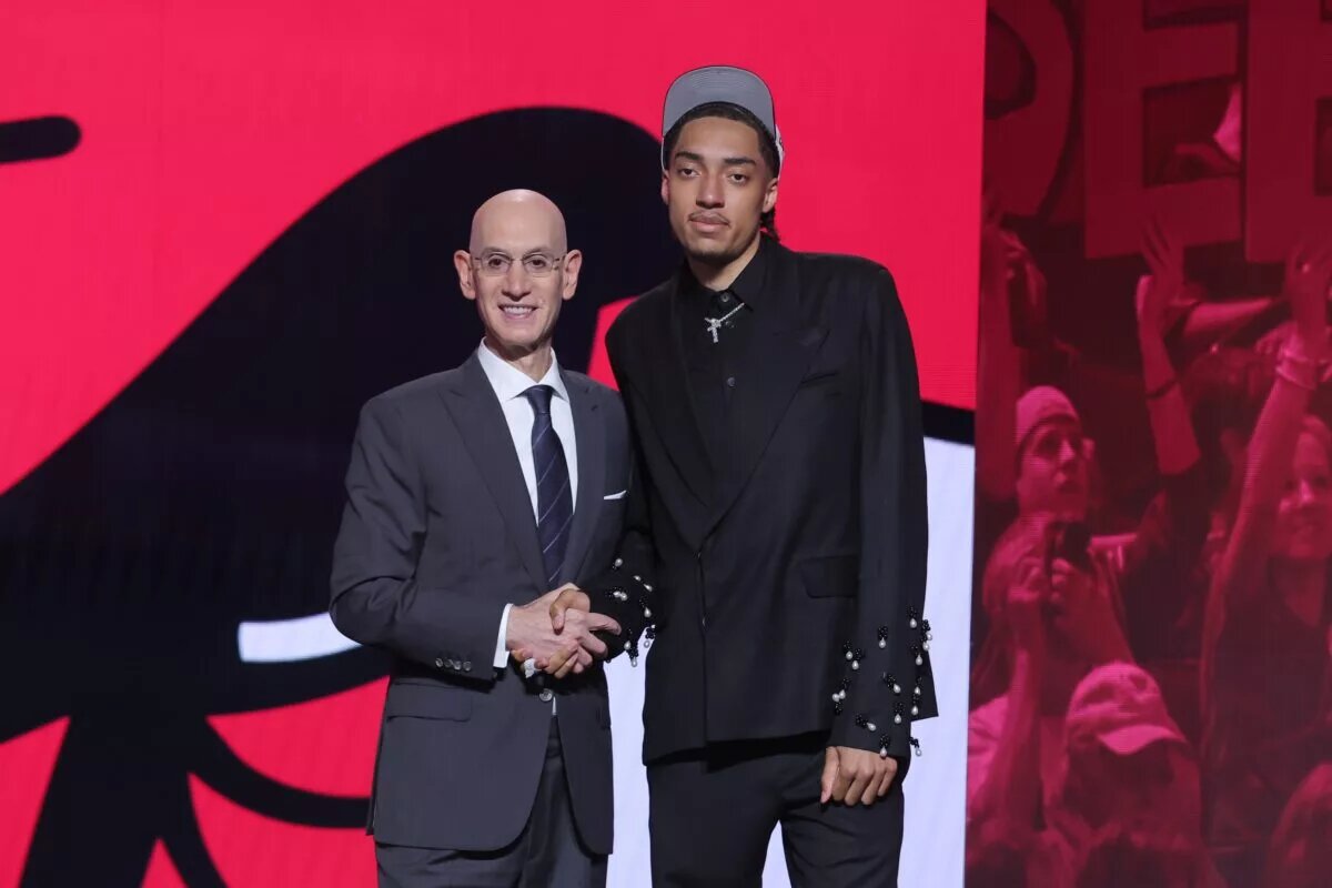 Jun 25, 2025; Brooklyn, NY, USA; Noa Essengue stands with NBA commissioner Adam Silver after being selected as the 12th pick by the Chicago Bulls in the first round of the 2025 NBA Draft at Barclays Center. Mandatory Credit: Brad Penner-Imagn Images