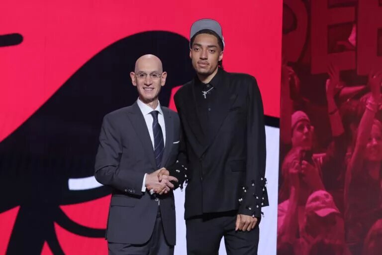Jun 25, 2025; Brooklyn, NY, USA; Noa Essengue stands with NBA commissioner Adam Silver after being selected as the 12th pick by the Chicago Bulls in the first round of the 2025 NBA Draft at Barclays Center. Mandatory Credit: Brad Penner-Imagn Images