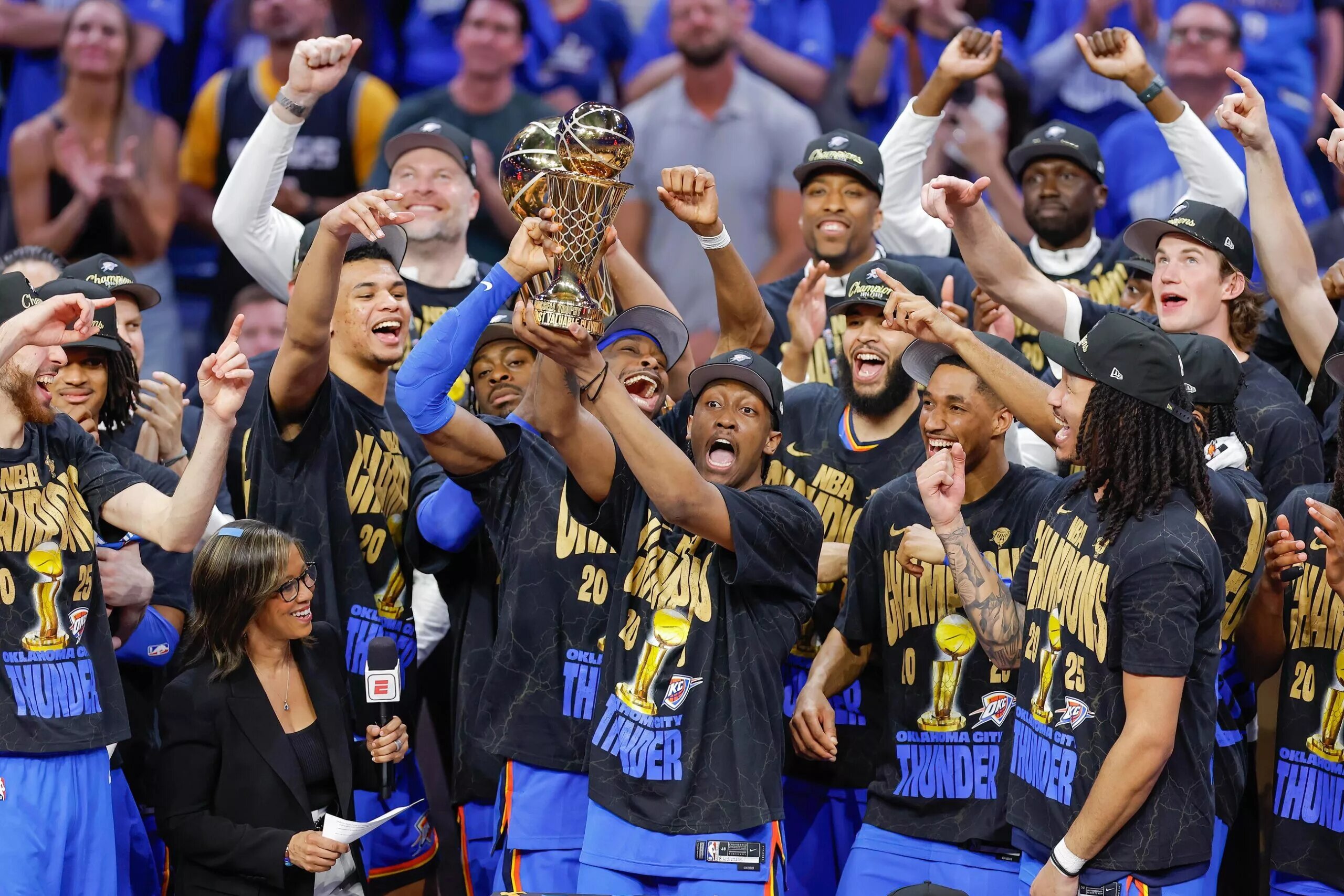 Jun 22, 2025; Oklahoma City, Oklahoma, USA; Oklahoma City Thunder forward Jalen Williams (8) holds up the Bill Russell NBA Finals MVP trophy after winner Oklahoma City Thunder guard Shai Gilgeous-Alexander hands it to him at the end of game seven of the 2025 NBA Finals against the Indiana Pacers at Paycom Center. Mandatory Credit: Alonzo Adams-Imagn Images