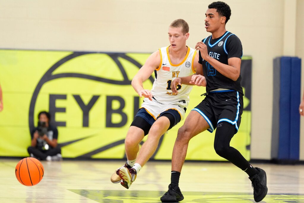 July 15, 2025; North Augusta, South Carolina, USA; NY Rens Gabriel Hornberger (13) and JL3 Abdul Aziz Olajuwon (15) battle for the ball during the NY Rens and JL3 game at Nike EYBL Peach Jam at Riverview Park Activities Center. The NY Rens won 83-53. Mandatory Credit: Katie Goodale - Augusta Chronicle/USA TODAY NETWORK