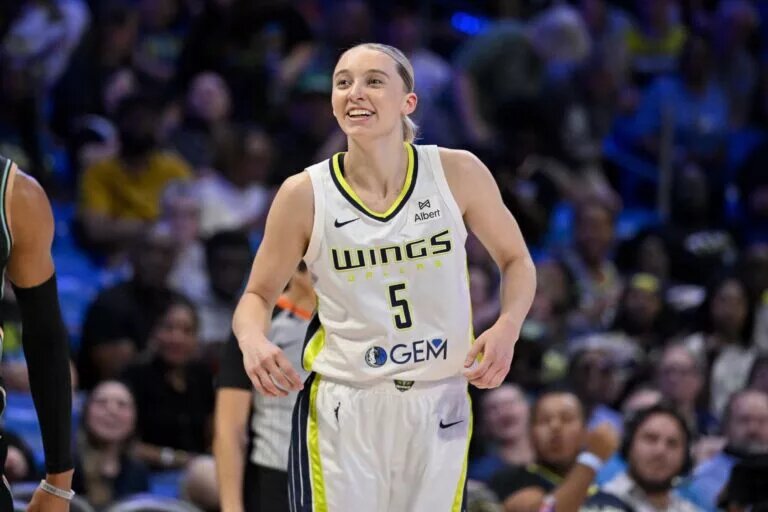 Jul 28, 2025; Arlington, Texas, USA; Dallas Wings guard Paige Bueckers (5) celebrates during the game between the Dallas Wings and the New York Liberty at College Park Center. Mandatory Credit: Jerome Miron-Imagn Images