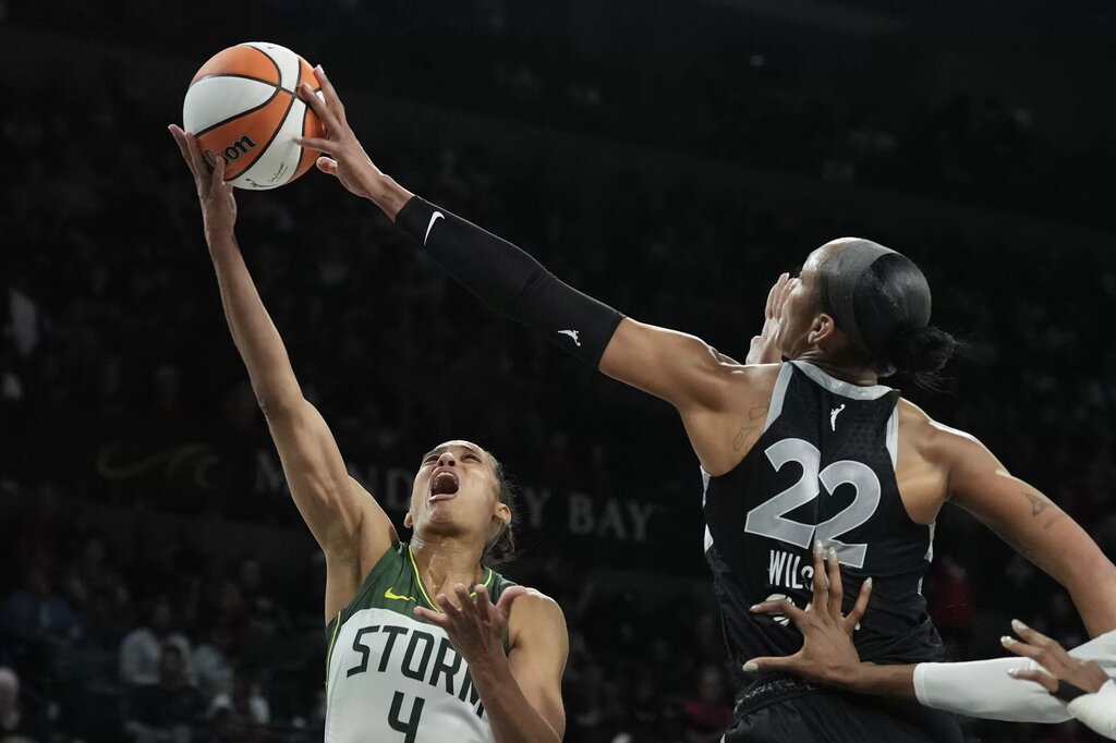 Sep 18, 2025; Las Vegas, Nevada, USA; Las Vegas Aces center A'ja Wilson (22) blocks a shot from Seattle Storm guard Skylar Diggins (4) in the third quarter during game three of round one for the 2025 WNBA Playoffs at Michelob Ultra Arena. Mandatory Credit: Candice Ward-Imagn Images