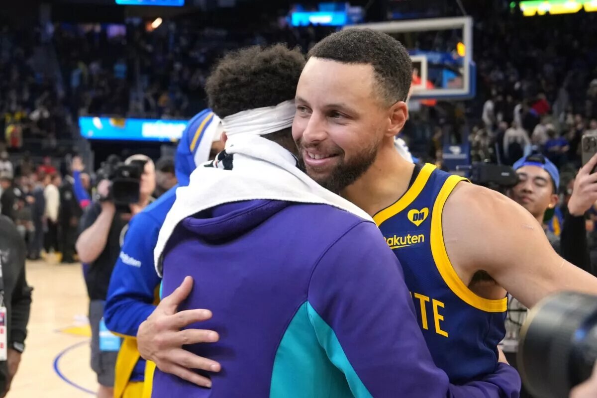 Feb 23, 2024; San Francisco, California, USA; Golden State Warriors guard Stephen Curry (right) hugs Charlotte Hornets guard Seth Curry (left) after the game at Chase Center. Mandatory Credit: Darren Yamashita-USA TODAY Sports