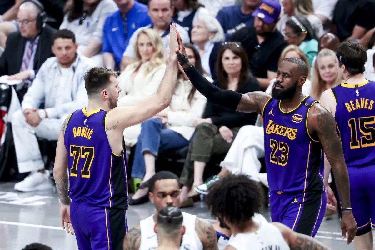 Apr 9, 2025; Dallas, Texas, USA; Los Angeles Lakers guard Luka Doncic (77) celebrates with Los Angeles Lakers forward LeBron James (23) during the fourth quarter against the Dallas Mavericks at American Airlines Center. Mandatory Credit: Kevin Jairaj-Imagn Images