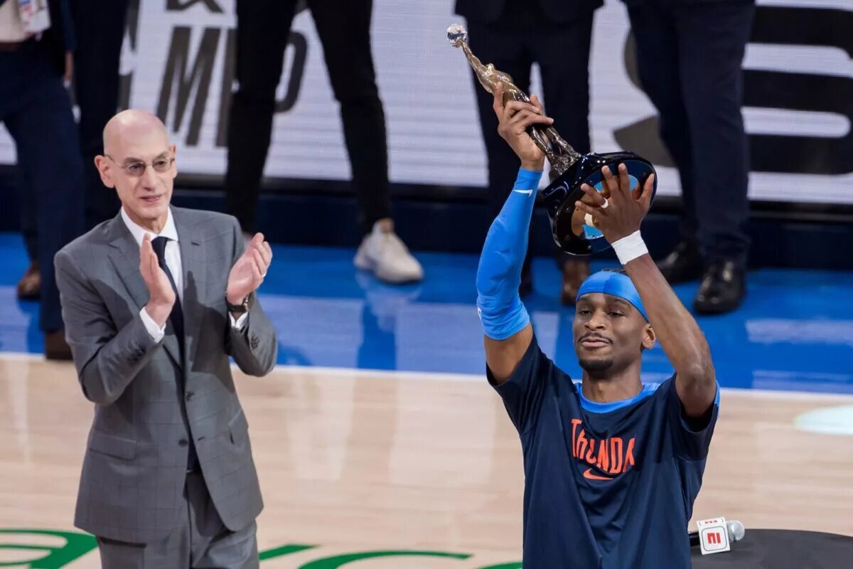 May 22, 2025; Oklahoma City, Oklahoma, USA; NBA commissioner is Adam Silver presents Oklahoma City Thunder guard Shai Gilgeous-Alexander (2) with the Michael Jordan Trophy for winning the most valuable player award for the 2024-25 season before game two of the western conference finals for the 2025 NBA Playoffs at Paycom Center. Mandatory Credit: Brett Rojo-Imagn Images