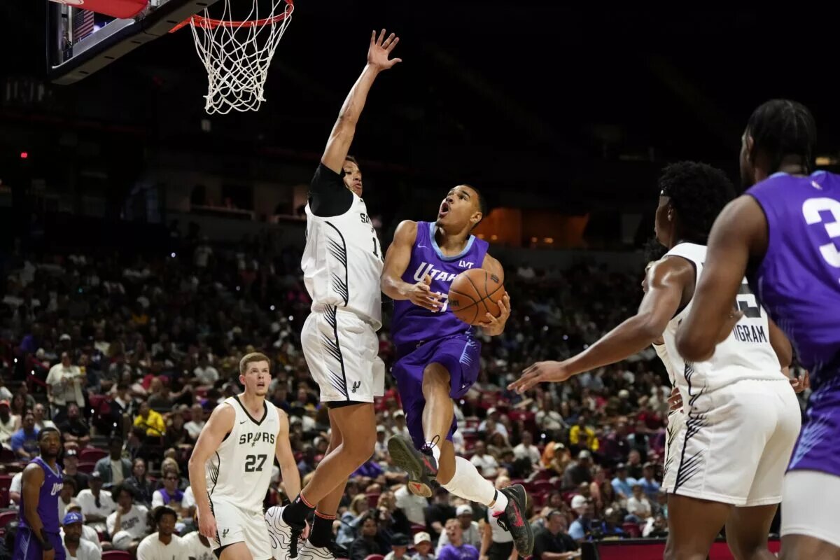 Utah Jazz rookie John Tonje attempts to score against San Antonio Spurs in Summer League