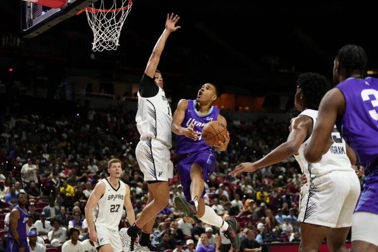 Utah Jazz rookie John Tonje attempts to score against San Antonio Spurs in Summer League