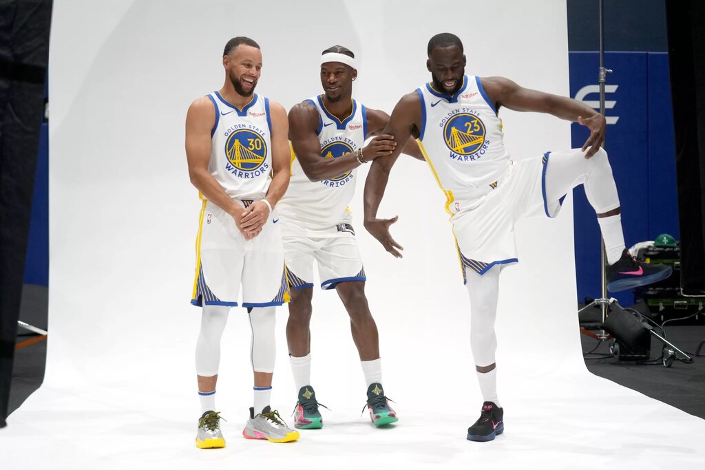 Golden State Warriors guard Stephen Curry (30), forward Draymond Green (23), and forward Jimmy Butler III 